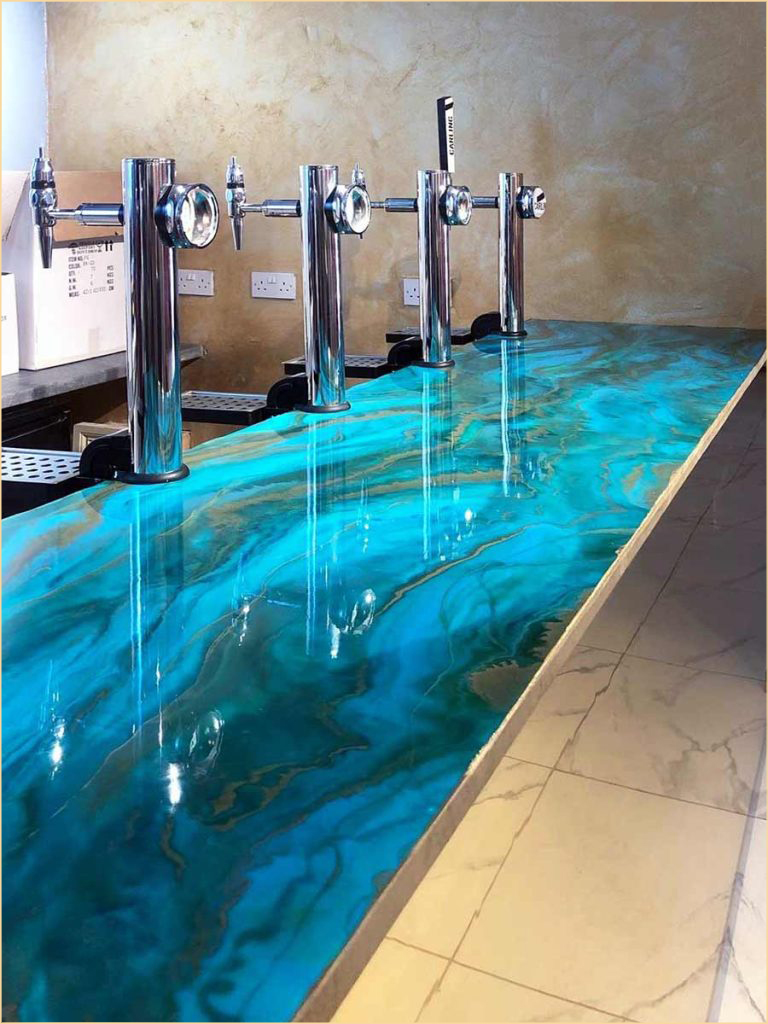 Professional resin flooring specialists installing epoxy floor systems